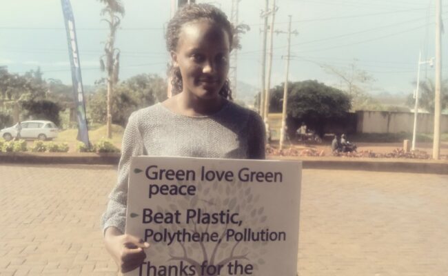 Ugandan climate activist protests on the street in Kampala.